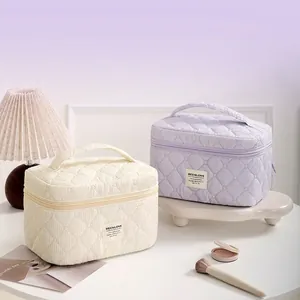 Elegant large capacity quilted makeup organizer with diamond pattern and carry handle