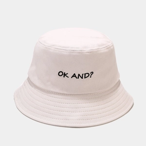 Detailed view of black OK AND embroidery on a high-quality white cotton bucket hat