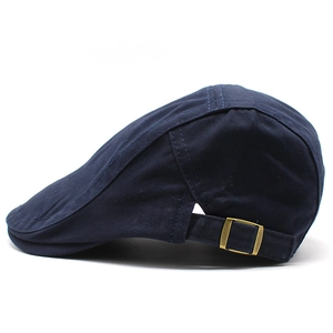 Classic navy cotton flat cap with adjustable bronze metal side buckle in side view