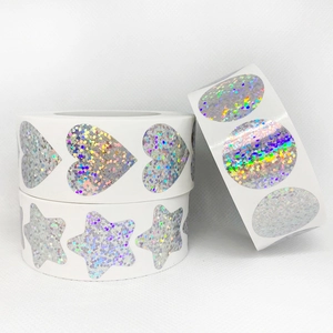 Rolls of holographic rainbow laser stickers in heart, star, and oval shapes for business