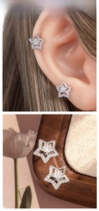 Detailed close-up of a sparkling star stud earring featuring zircon pave-set accents