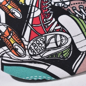Detail of canvas texture with colorful pop-art sneaker print on a stylish baseball cap