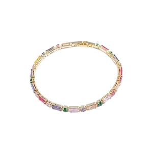 Colorful zircon tennis bracelet with gold plating on a minimalist white background