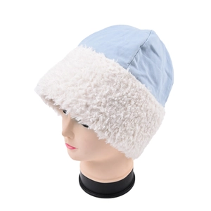 Detail of light blue windproof fabric and white faux lamb wool brim on a winter bucket hat