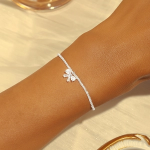 Close-up of S925 sterling silver bracelet featuring a diamond-studded butterfly pendant