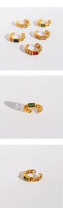 Detailed views of gold chain ear cuffs featuring colorful rectangular zircon stones