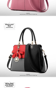 Close-up of color-block tote bag with litchi texture, bow charm, and golden ornament