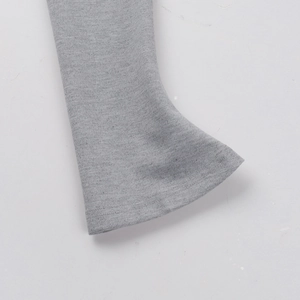 Close-up detail of double-needle stitching on grey knitted sleeve cuffs for casual dress