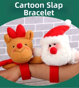 Detail of Santa and reindeer plush snap bracelets being worn on a wrist for Christmas