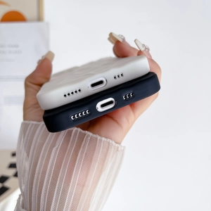 Detailed close-up of precise charging port and speaker cutouts on puffy silicone cases