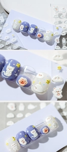 Close-up of 5D embossed nail stickers featuring cute 3D cat, bear, and cloud designs