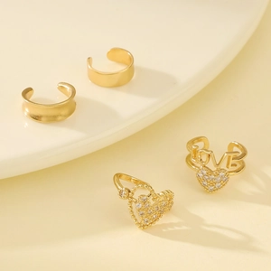 Elegant 4-piece gold ear cuff set with LOVE letter, heart and minimalist hoop designs