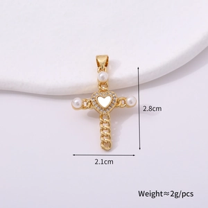 Detailed view of golden cross pendant with heart shell inlay and pearl accents showing dimensions