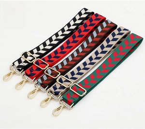 Adjustable jacquard bag straps with V-shaped geometric patterns and gold swivel hooks