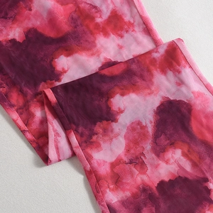Detailed macro view of pink and purple tie-dye breathable mesh fabric with neat stitching