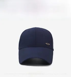 Detail of navy blue mesh baseball cap showing breathable fabric and golden fashion metal plate