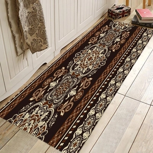 Detail of bohemian mandala runner rug on wood floor with intricate chocolate patterns