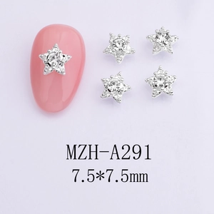 Close-up of star-shaped nail charms with silver base and crystal rhinestones 7.5mm