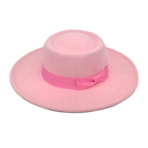 Close-up of pink wool fedora hat featuring a matching ribbon bow on the crown