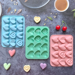 Set of 3 heart-shaped silicone molds in blue, green, and pink for DIY candy and chocolates