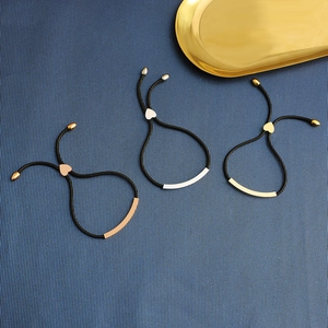 Three-piece braided rope bracelets with rose gold, silver, and gold curved metal bars
