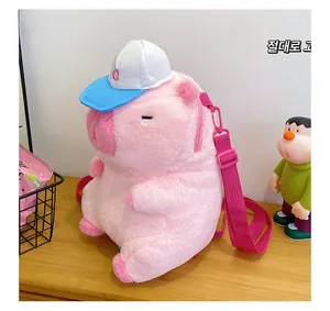 Detail of pink plush pig backpack with embroidery eyes and mini baseball cap accessory