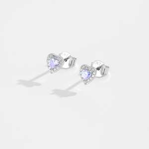 Macro shot of S925 sterling silver heart earrings with purple zircon stones