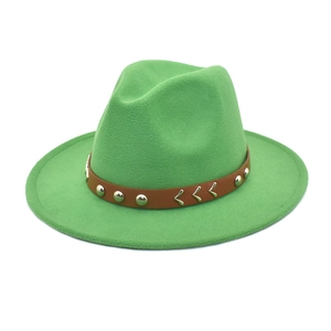 Detailed view of wide-brim green wool fedora with brown studded leather belt decoration