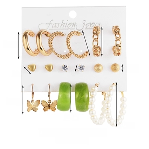 Detailed view of alloy earring set with acrylic hoops, pearls and butterfly pendants