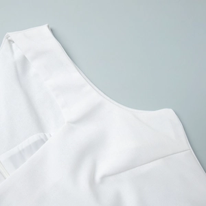 Close-up of white square neck dress showing high-quality textured linen fabric details