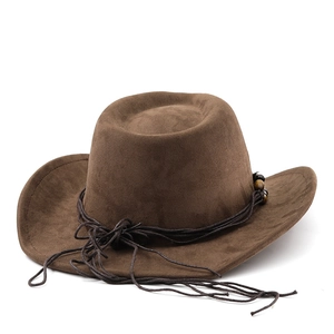 Close-up of suede texture and beaded rope detail on a dark brown western cowboy hat