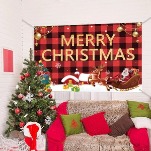 Macro detail of Merry Christmas banner with red plaid pattern and reindeer sleigh scene