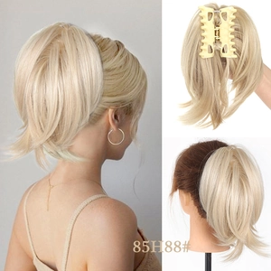 Detailed view of light blonde claw clip ponytail hairpiece with natural wavy texture