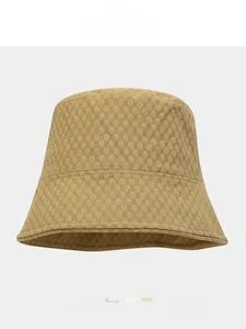 Close-up of khaki bucket hat showing breathable honeycomb fabric texture and fine stitching