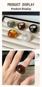 Retro resin chunky rings in various colors displayed on a stand and worn on finger