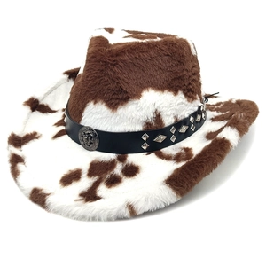 Faux fur cow print cowboy hat with studded leather band and metal skull ornament
