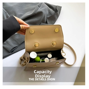 Detail view of khaki crossbody bag interior showing storage capacity for daily essentials