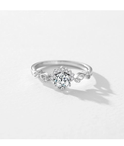 Macro shot of S925 silver ring with sparkling round cut zircon and infinity twisted band