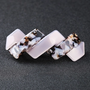 Elegant acetate barrette hair clip in pink and tortoiseshell with wavy geometric design