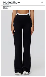 Détail du pantalon évasé taille haute en noir premium avec bordure de taille contrastée
