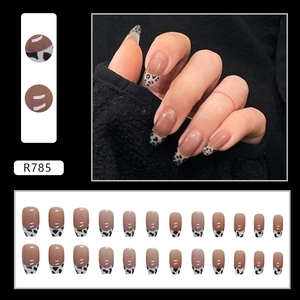 Pink French nails with black and white leopard print tips and medium square shape