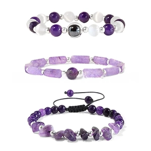 Detail of amethyst bracelet set featuring round beads, rectangular slices and raw stones
