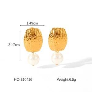 Detail view of gold hammered texture heart earrings with pearls and precise dimensions