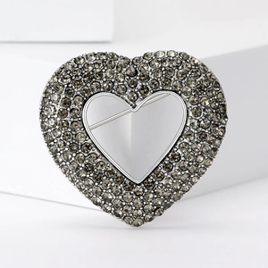 Elegant vintage heart brooch with dark grey rhinestones on a silver metal base