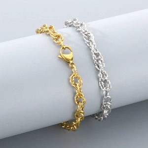 Detail of twisted cable chain bracelets in gold and silver finish for men and women