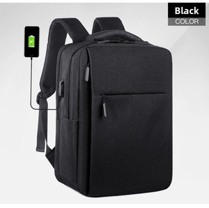 Detail view of business backpack showing integrated USB charging port and black waterproof fabric