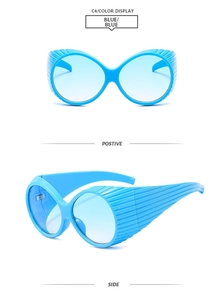 Detail view of bright blue oversized Y2K sunglasses with unique side shading stripes