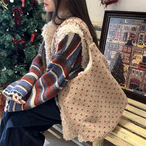 Detail of beige fleece tote bag with red polka dots and a spacious fabric interior