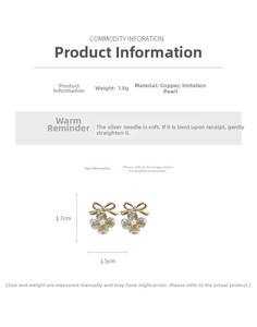 Detail of flower earrings with gold bow, faux pearl center, and translucent petals