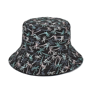 Close-up of black bucket hat featuring tropical palm tree print in green and pink tones